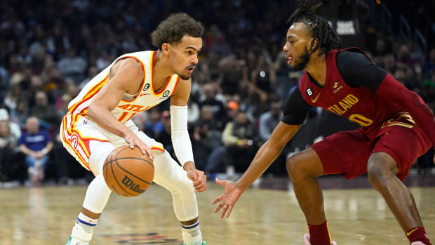 Cavaliers guard Darius Garland defends Hawks guard Trae Young.